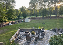 Fence enclosing patio and backyard